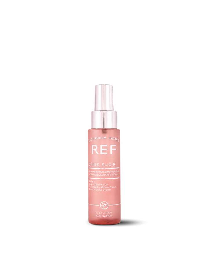 REF Stockholm Shine Elixir 80ml — official front product shot on white background, showing the pink glass spray bottle with silver cap and full label text. Source: refstockholm.com official product page (shine-elixir).
