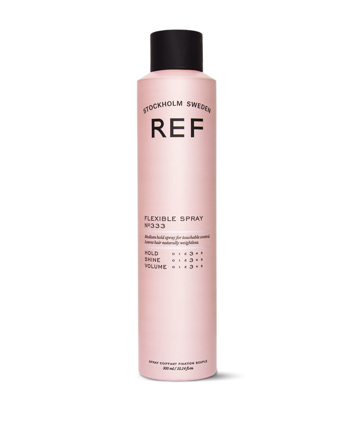 REF Stockholm Flexible Spray N°333 (300ml) — official front product/pack shot from refstockholm.com, showing the full pink bottle with black cap and label (hold/shine/volume ratings visible).