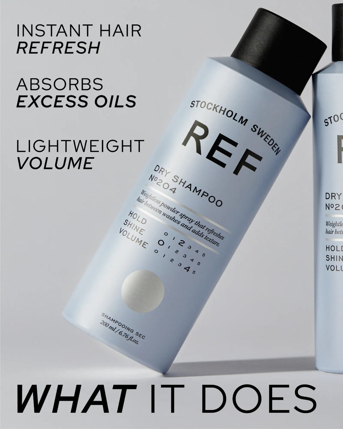 Alternate angle marketing shot - Dry Shampoo N°204 cans tilted, with REF's 'What It Does' benefit callouts (instant refresh, absorbs excess oils, lightweight volume)
