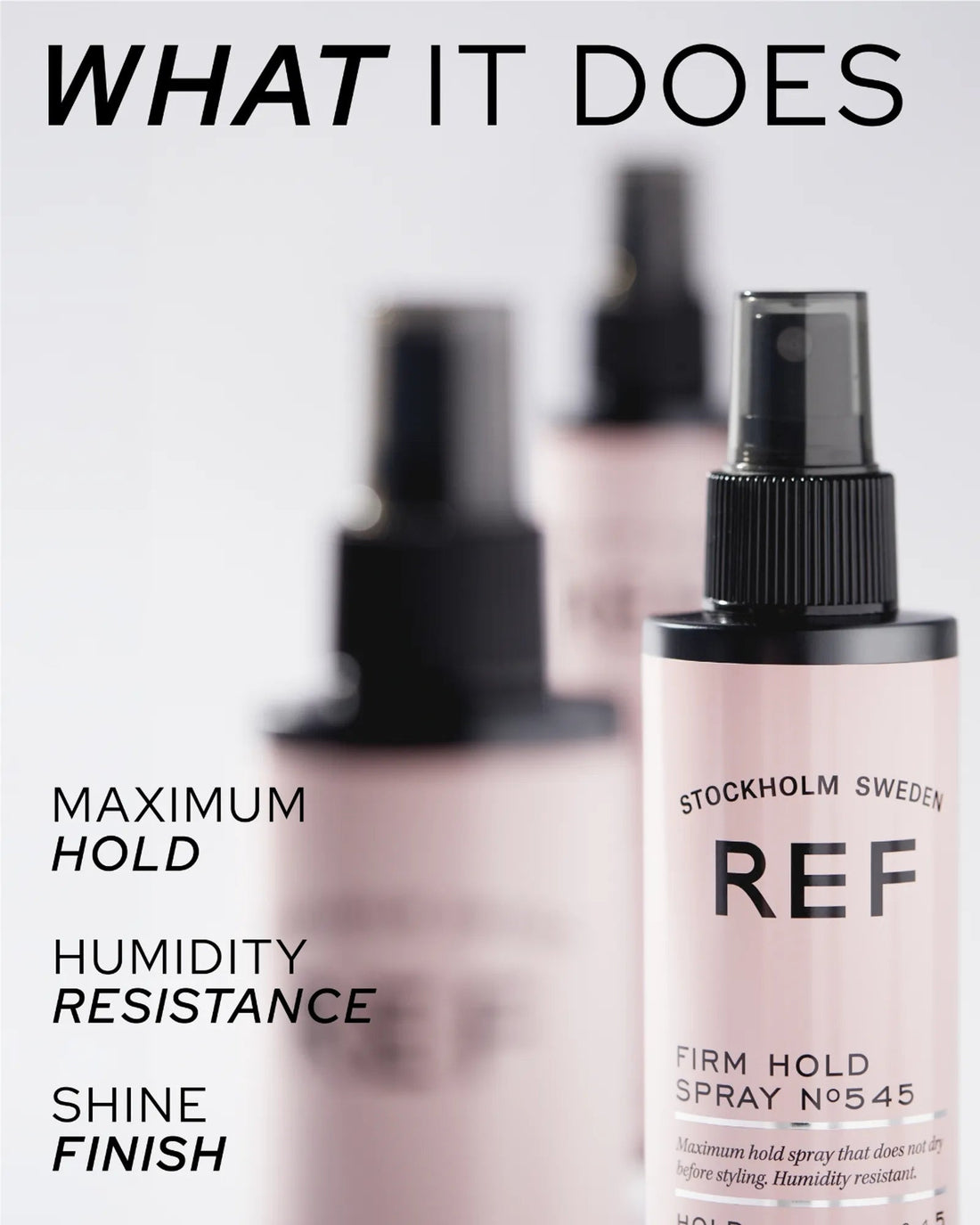 Official REF Stockholm lifestyle/editorial shot titled 'What It Does' — close-up of the Firm Hold Spray N°545 bottle with two additional blurred bottles behind it, callouts for Maximum Hold, Humidity Resistance, and Shine Finish.