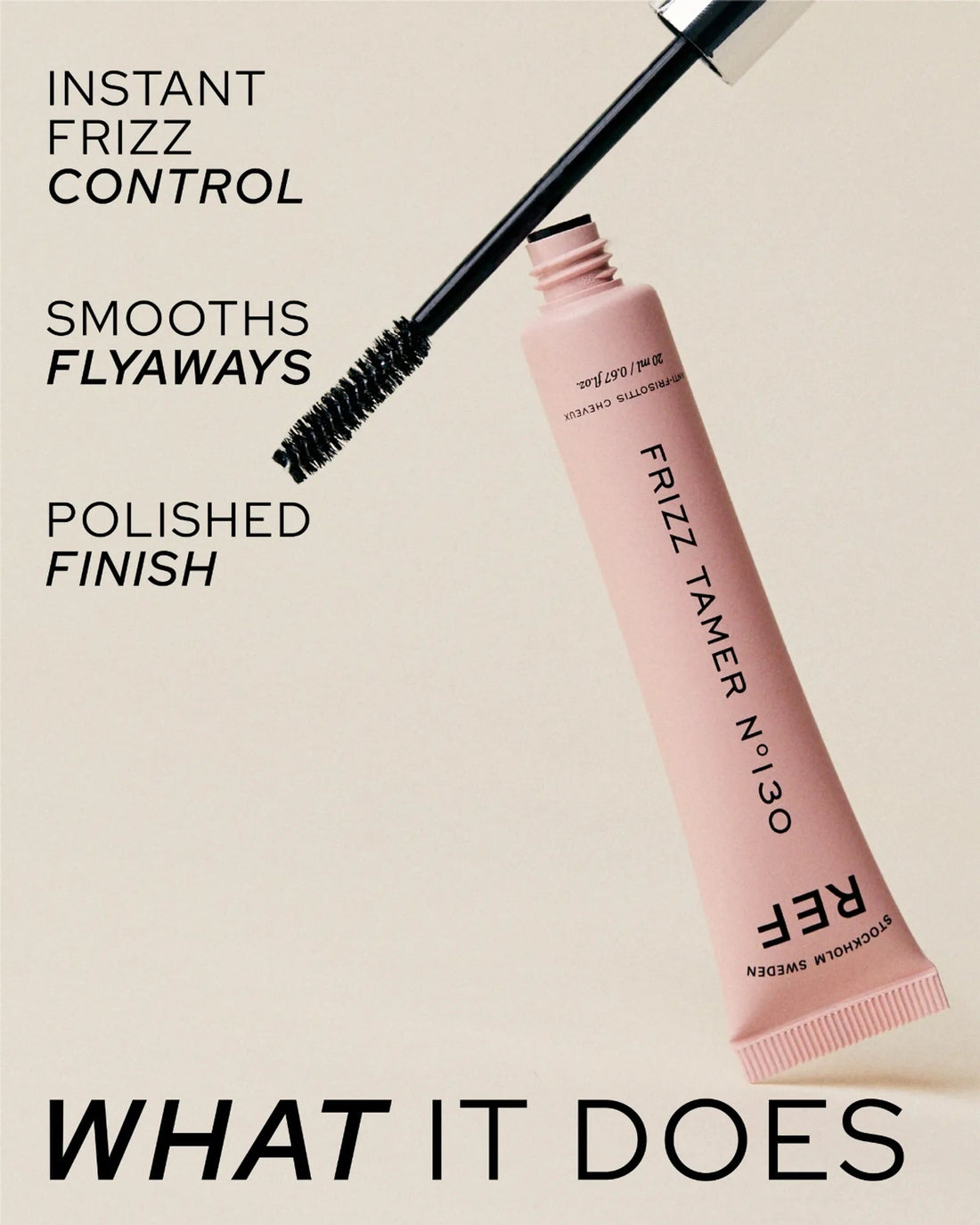 Alternate angle: official product photo of the Frizz Tamer N°130 tube with its mascara-style wand applicator uncapped, from the 'What It Does' panel on refstockholm.com.