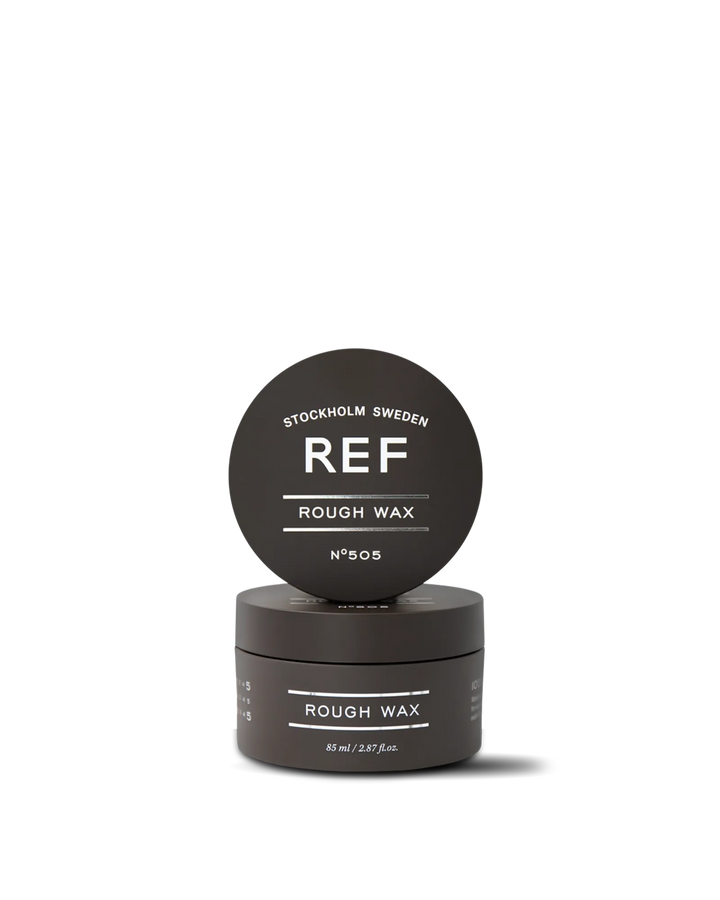 Official REF Stockholm front/hero product shot of Rough Wax N°505 (85ml) — studio photo of the matte dark jar with its lid propped on top, showing 'REF STOCKHOLM SWEDEN / ROUGH WAX / N°505' branding. Sourced directly from refstockholm.com's own product page (used as its canonical og:image); verified HTTP 200 and confirmed identical to the image used by authorized REF distributors.