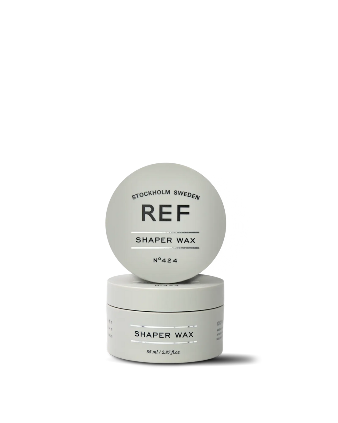 Official REF Stockholm front pack shot: two Shaper Wax N°424 85ml jars, one open lid showing 'REF STOCKHOLM SWEDEN / SHAPER WAX / N°424' branding, one closed jar showing the full product label.
